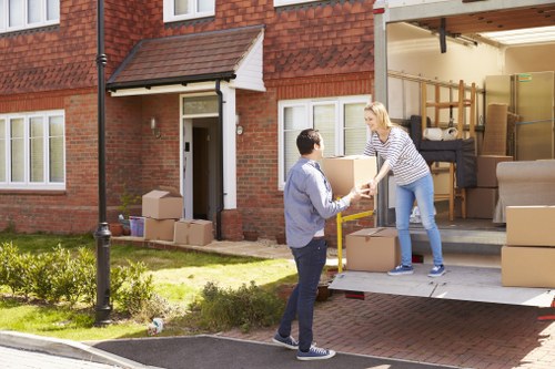 Man and van loading furniture for a move in Brent
