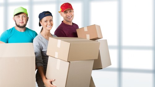 A local removals crew unloading boxes at a Brent flat
