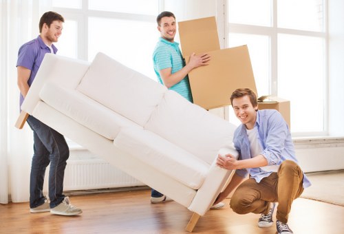 Packing and labelling office items before a move in Brent