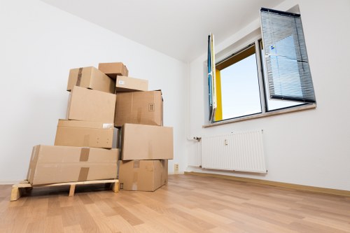 Packed moving boxes and furniture for a Brent home relocation