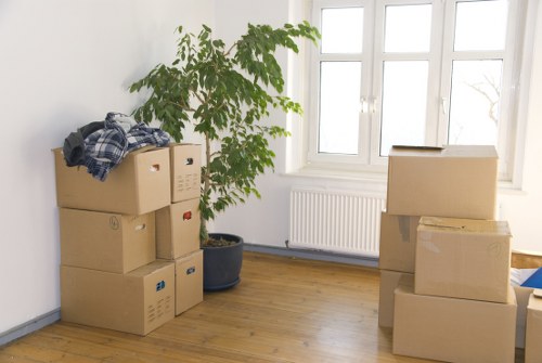 Local movers carrying furniture during a Brent house removal