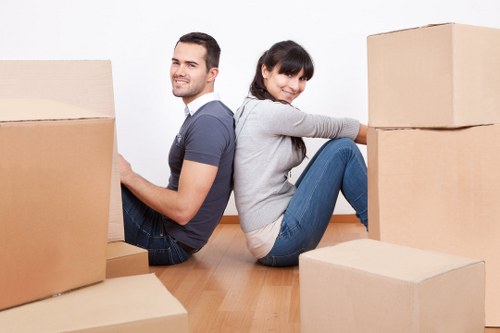 Local office movers handling desks and equipment in a Brent business area