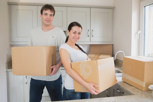 Loading furniture into a removal truck in Brent